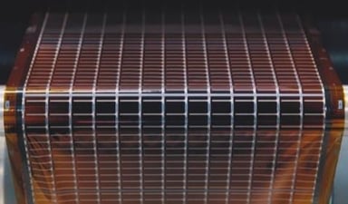 A roll of amorphous silicon solar material is about to be encapsulated.