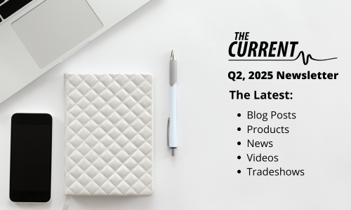 Flat lay of a laptop, smartphone, quilted notebook, and pen next to text reading 'The Current Q2, 2025 Newsletter' with a list of updates: blog posts, products, news, videos, tradeshows. Flat lay of a laptop, smartphone, quilted notebook, and pen next to text reading 'The Current Q2, 2025 Newsletter' with a list of updates: blog posts, products, news, videos, tradeshows.