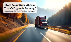 A red semi-truck driving on a highway through a mountainous landscape with autumn-colored trees. The sky is bright, and the road is curving slightly. A white text box in the upper left corner contains the title: "Does Solar Work When a Truck is Moving? Debunking the Myth for Fleet Managers."