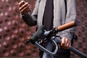 man holding a bike with a smart bike lock