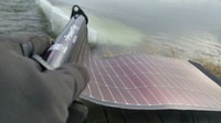 Canadian Prepper flexing the LightSaver Portable Solar Charger (200 x 112)