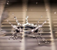 water droplet bouncing off an amorphous silicon solar panel