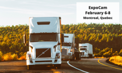 Three semi-trucks driving on a scenic highway with a forested backdrop. A white box in the upper right corner reads: 'ExpoCam February 6-8 Montreal, Quebec.'