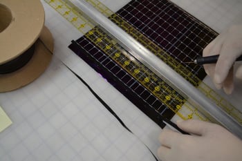 hand trimming an amorphous silicon thin-film solar panel