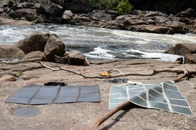 Amorphous silicon thin film solar panel unfolded next to water Amorphous silicon thin film solar panel unfolded next to water