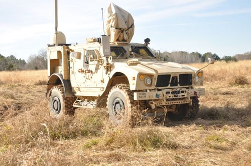 military vehicle in a field military vehicle in a field