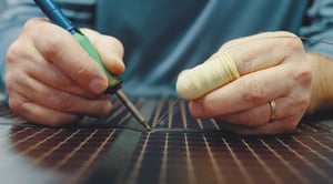 man wiring a foldable solar panel man wiring a foldable solar panel